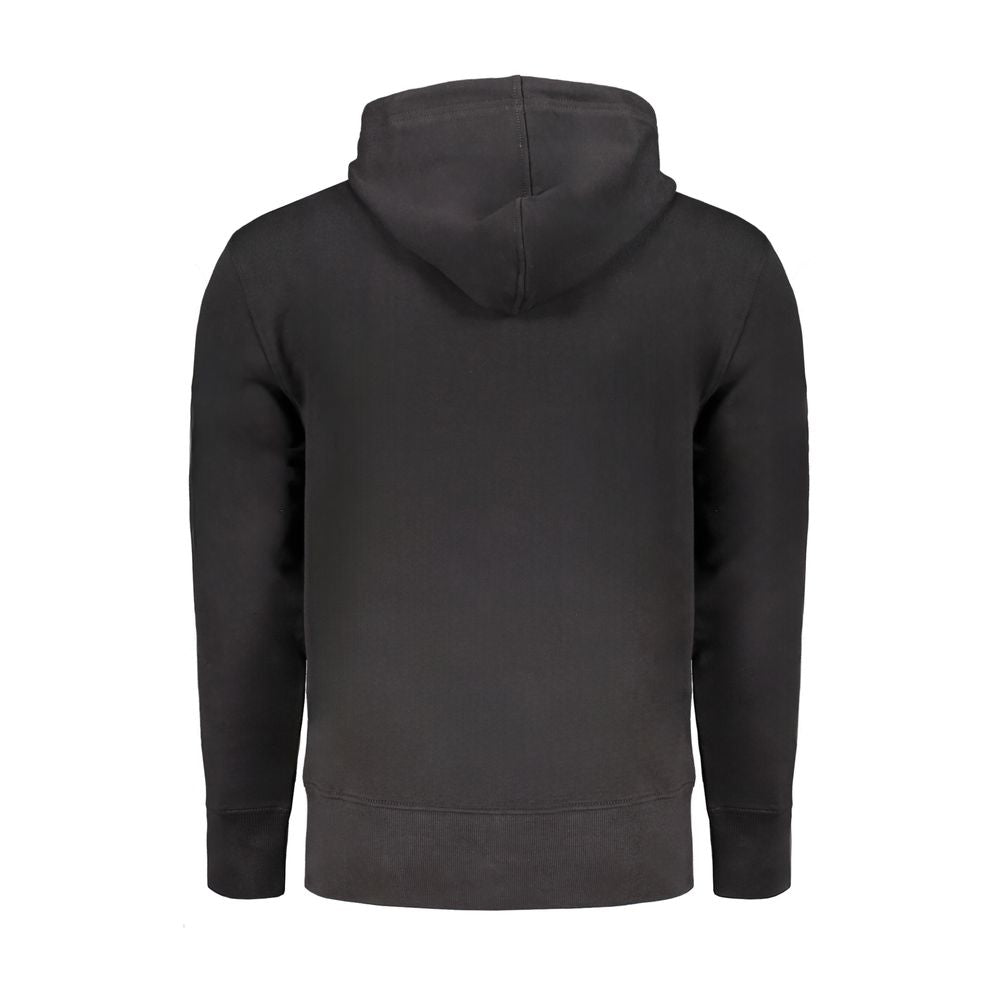 Black Cotton Men Sweater with Hood and Central PocketsDive into effortless sophistication with Calvin Klein’s sleek black hoodie. Designed for the modern trendsetter, this long-sleeved sweatshirt features a brushed finish that epitomizes casual luxury. Th