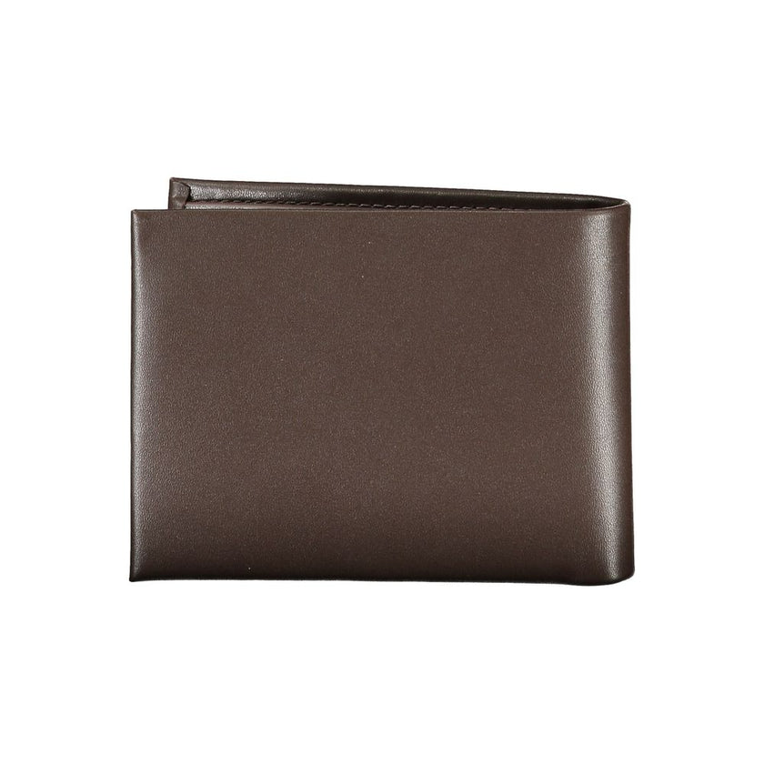 Elegant Leather Wallet with RFID BlockExperience sophistication with the Calvin Klein wallet, your essential companion for every occasion. Crafted from 100% premium leather, this wallet features two main compartments, a practical coin purse, and multiple