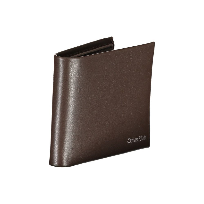 Elegant Leather Wallet with RFID BlockExperience sophistication with the Calvin Klein wallet, your essential companion for every occasion. Crafted from 100% premium leather, this wallet features two main compartments, a practical coin purse, and multiple