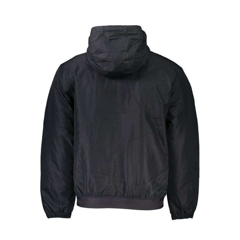Black Polyester Men JacketInfuse your wardrobe with the sleek sophistication of Calvin Klein’s long-sleeved jacket — an essential for the modern trendsetter. Masterfully crafted to brave the elements, it boasts a removable hood with a zip for versatile st