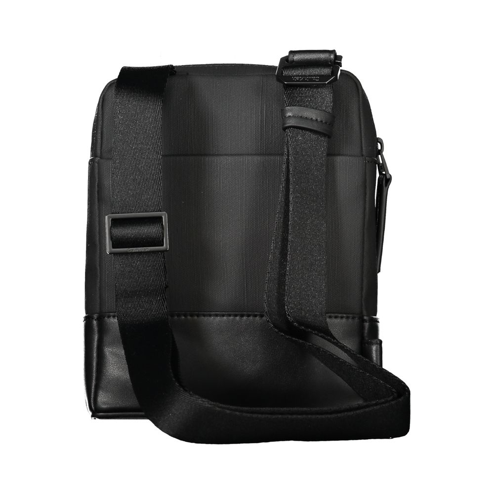 Black Polyester Men Shoulder BagExude confidence and style with this sleek Calvin Klein shoulder bag—an investment in your daily arsenal. Crafted for the modern man on the move, this accessory boasts practicality without sacrificing its urbane appeal. Wit