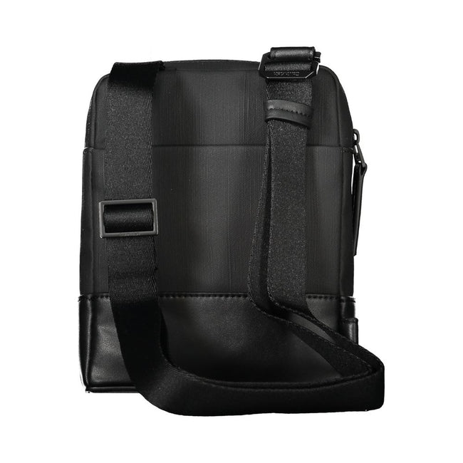 Black Polyester Men Shoulder BagExude confidence and style with this sleek Calvin Klein shoulder bag—an investment in your daily arsenal. Crafted for the modern man on the move, this accessory boasts practicality without sacrificing its urbane appeal. Wit