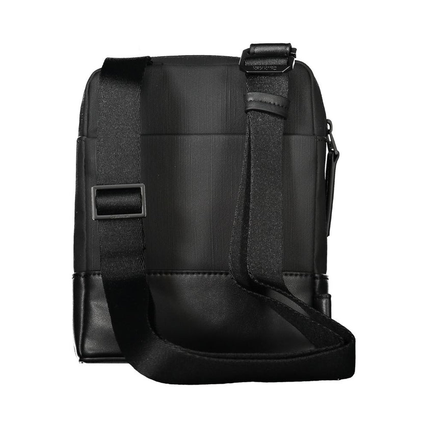 Black Polyester Men Shoulder BagExude confidence and style with this sleek Calvin Klein shoulder bag—an investment in your daily arsenal. Crafted for the modern man on the move, this accessory boasts practicality without sacrificing its urbane appeal. Wit