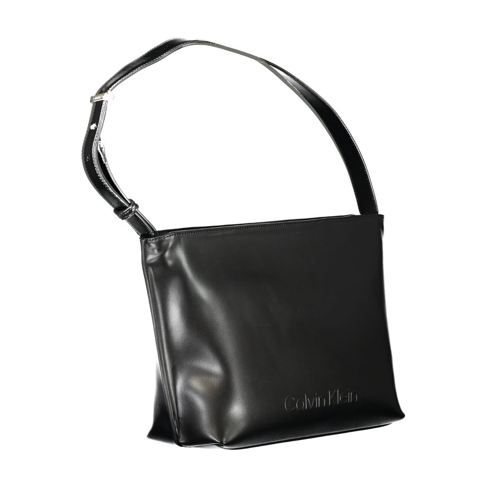 Black Polyester Women HandbagExperience the epitome of urban-chic with Calvin Klein’s sleek shoulder bag, a statement piece designed for the modern trendsetter. Crafted with environmental consciousness, this bag boasts a composition of 50% recycled polyes