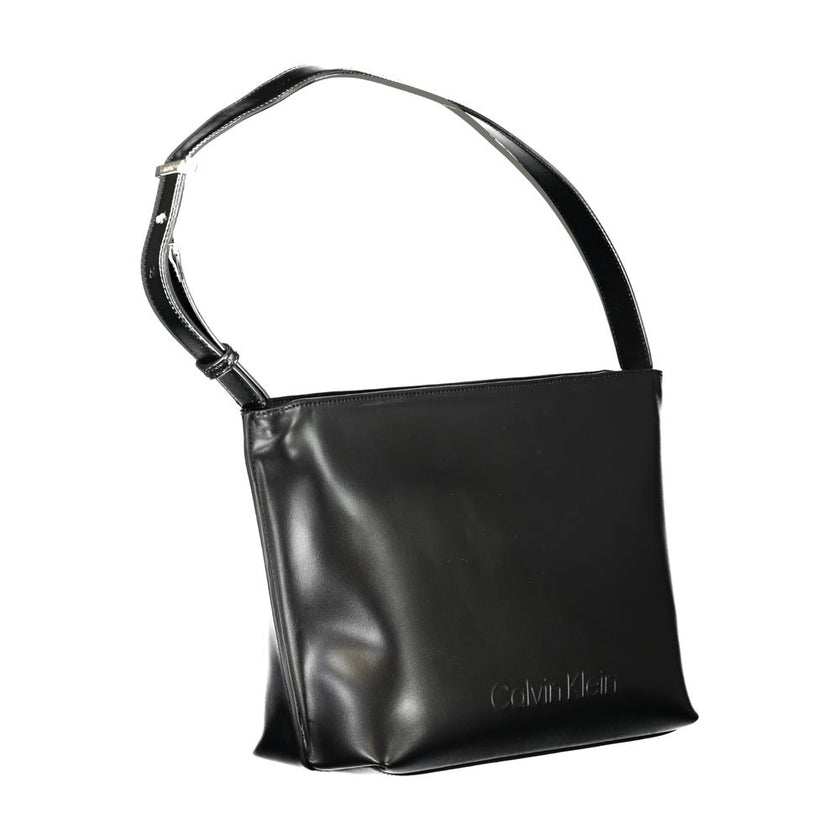 Black Polyester Women HandbagExperience the epitome of urban-chic with Calvin Klein’s sleek shoulder bag, a statement piece designed for the modern trendsetter. Crafted with environmental consciousness, this bag boasts a composition of 50% recycled polyes