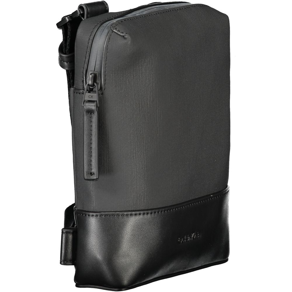 Black Polyester Men Shoulder BagExude confidence and style with this sleek Calvin Klein shoulder bag—an investment in your daily arsenal. Crafted for the modern man on the move, this accessory boasts practicality without sacrificing its urbane appeal. Wit