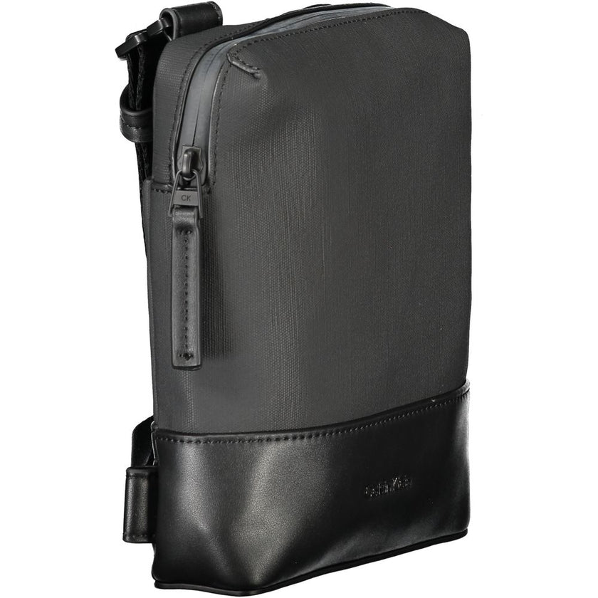 Black Polyester Men Shoulder BagExude confidence and style with this sleek Calvin Klein shoulder bag—an investment in your daily arsenal. Crafted for the modern man on the move, this accessory boasts practicality without sacrificing its urbane appeal. Wit