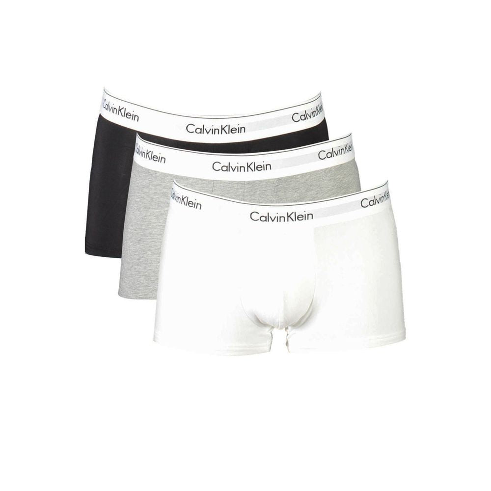 Brown Cotton Men BoxerElevate your essentials with Calvin Klein’s tri-pack low-waisted boxer shorts. Blending style and sustainability, these iconic undergarments in a versatile brown palette feature the brand’s bold logo on an elastic waistband. Crafted