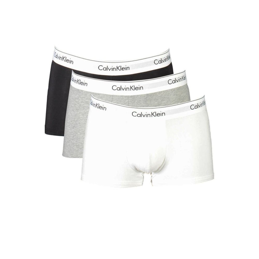 Brown Cotton Men BoxerElevate your essentials with Calvin Klein’s tri-pack low-waisted boxer shorts. Blending style and sustainability, these iconic undergarments in a versatile brown palette feature the brand’s bold logo on an elastic waistband. Crafted