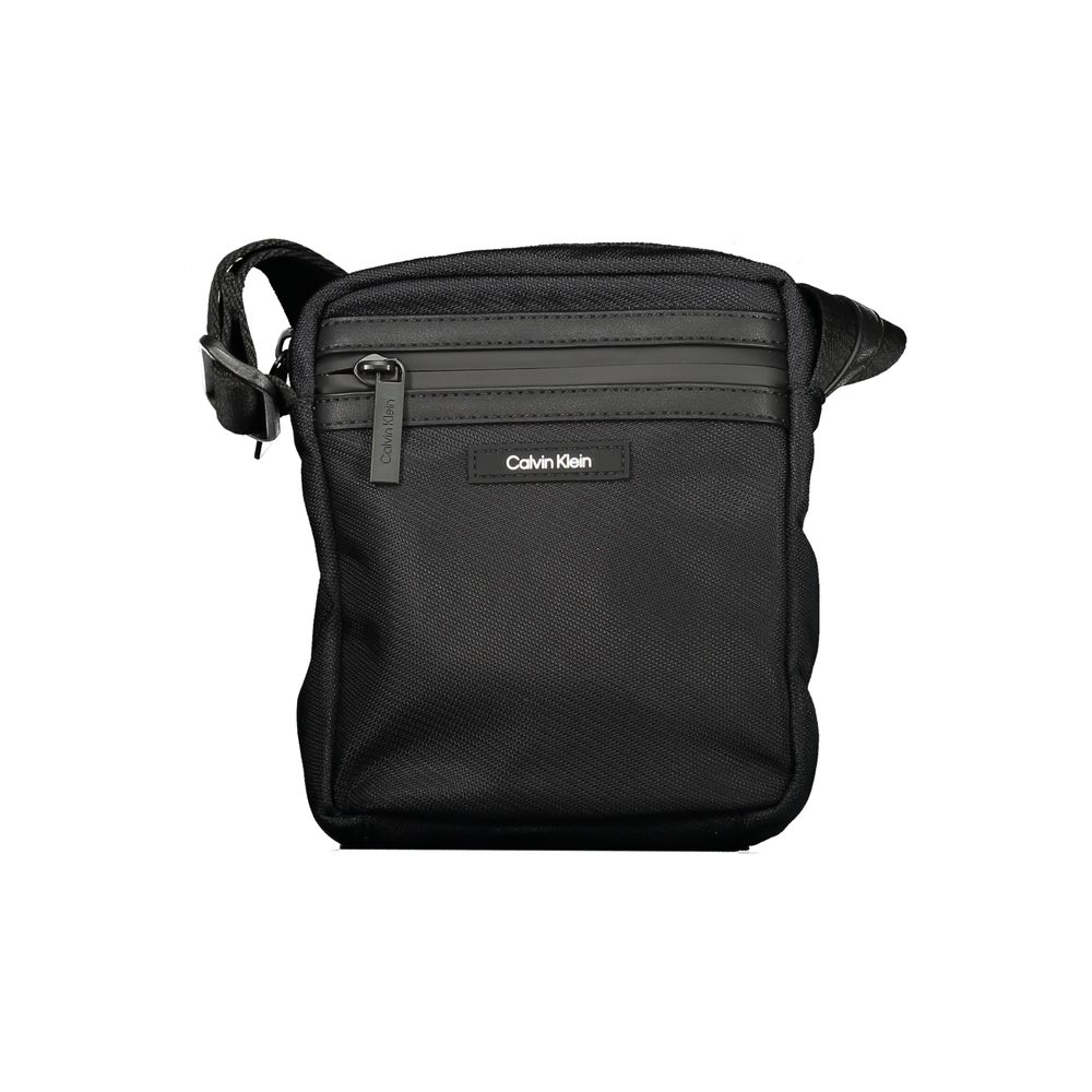Black Polyester Men Shoulder BagElevate your accessory game with the sophisticated edge of a Calvin Klein shoulder bag, the perfect blend of functionality and sleek style. Boasting adjustable straps for a custom fit, this bag features two convenient exter