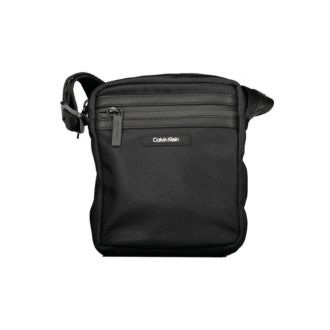 Black Polyester Men Shoulder BagElevate your accessory game with the sophisticated edge of a Calvin Klein shoulder bag, the perfect blend of functionality and sleek style. Boasting adjustable straps for a custom fit, this bag features two convenient exter