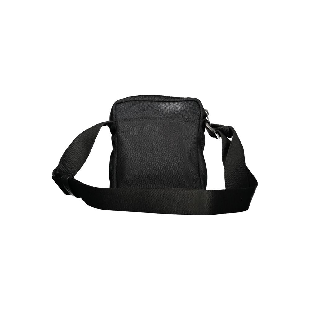 Black Polyester Men Shoulder BagElevate your accessory game with the sophisticated edge of a Calvin Klein shoulder bag, the perfect blend of functionality and sleek style. Boasting adjustable straps for a custom fit, this bag features two convenient exter