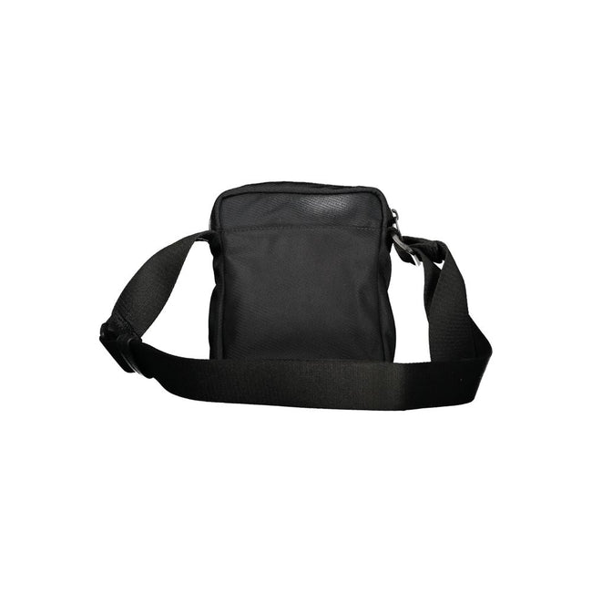 Black Polyester Men Shoulder BagElevate your accessory game with the sophisticated edge of a Calvin Klein shoulder bag, the perfect blend of functionality and sleek style. Boasting adjustable straps for a custom fit, this bag features two convenient exter