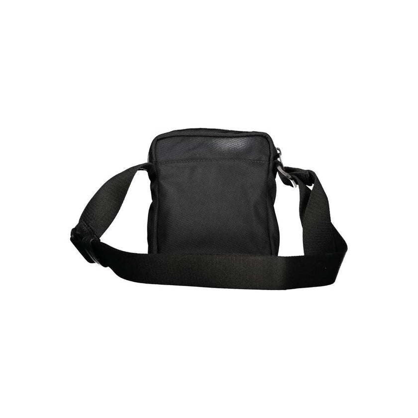 Black Polyester Men Shoulder BagElevate your accessory game with the sophisticated edge of a Calvin Klein shoulder bag, the perfect blend of functionality and sleek style. Boasting adjustable straps for a custom fit, this bag features two convenient exter