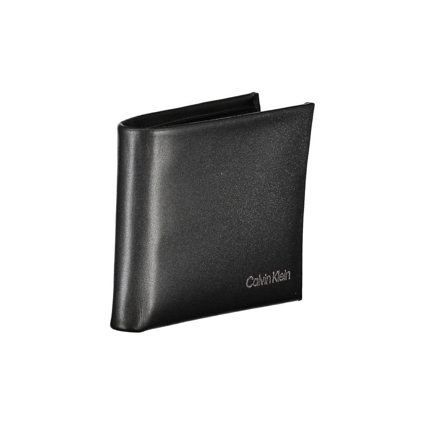 Black Polyester Men WalletEmbrace the epitome of sleek sophistication with this Calvin Klein RFID-blocking wallet. Engineered to secure your essentials with its dual card compartments, it’s more than just an accessory; it’s a statement. Practical yet poli