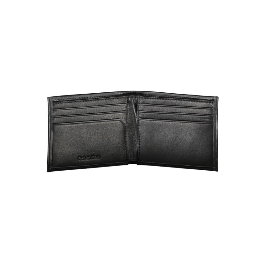 Black Polyester Men WalletEmbrace the epitome of sleek sophistication with this Calvin Klein RFID-blocking wallet. Engineered to secure your essentials with its dual card compartments, it’s more than just an accessory; it’s a statement. Practical yet poli