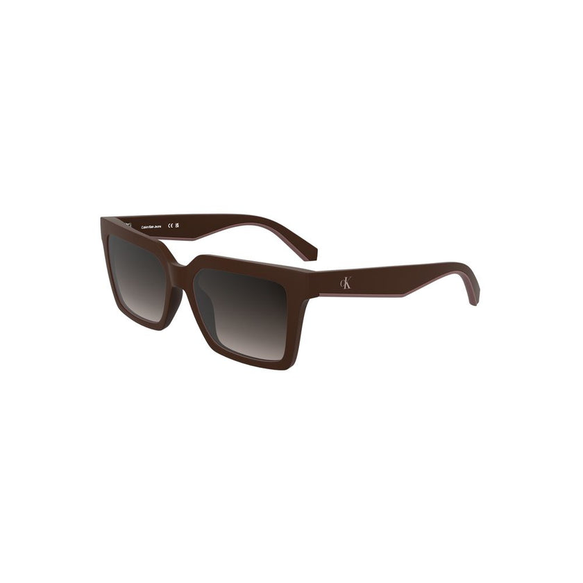 Red Bio-Based Fabric Women SunglassStep into the sunlight with sophistication wearing these Calvin Klein sunglasses, designed for the fashion-forward individual. The chic bio-based frames hug square brown lenses, exuding an eco-friendly allure, while the