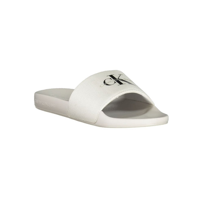 White Polyester Women SandalIndulge in the epitome of contemporary chic with these Calvin Klein logo-print sliders. Perfect for a stylish escape to the poolside or a casual stroll in the city, these sandals embody the effortless elegance synonymous with C