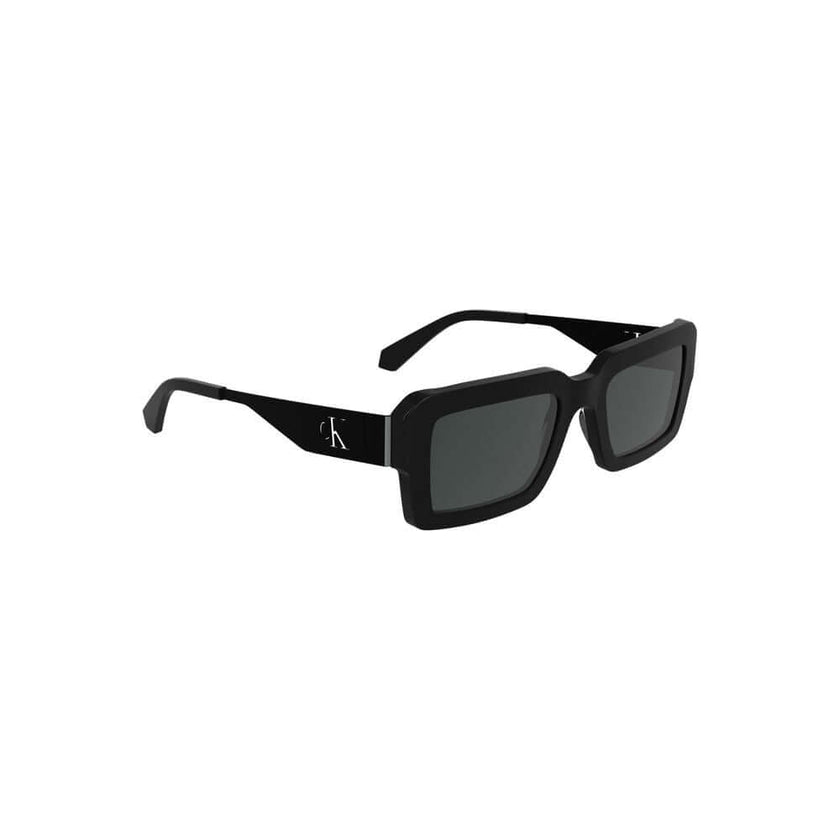Black Acetate Women SunglassesElevate your gaze with the sleek sophistication of Calvin Klein’s acetate frame sunglasses. The epitome of sharp style, these striking rectangular lenses boast a seamless black tint, perfect for commanding presence and protec