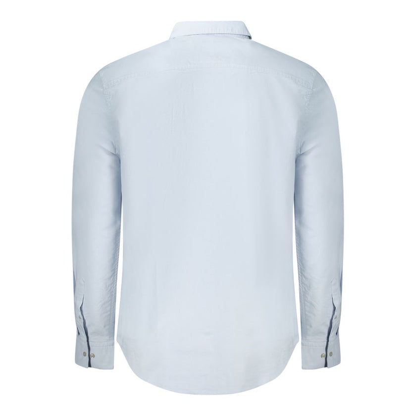 Light Blue Cotton Men ShirtElevate your wardrobe with the timeless sophistication of Calvin Klein. Tailored for a classic fit, this long sleeve shirt features a sharp button-down collar and adjustable 2-button cuffs. Detailed with exquisite embroidery and