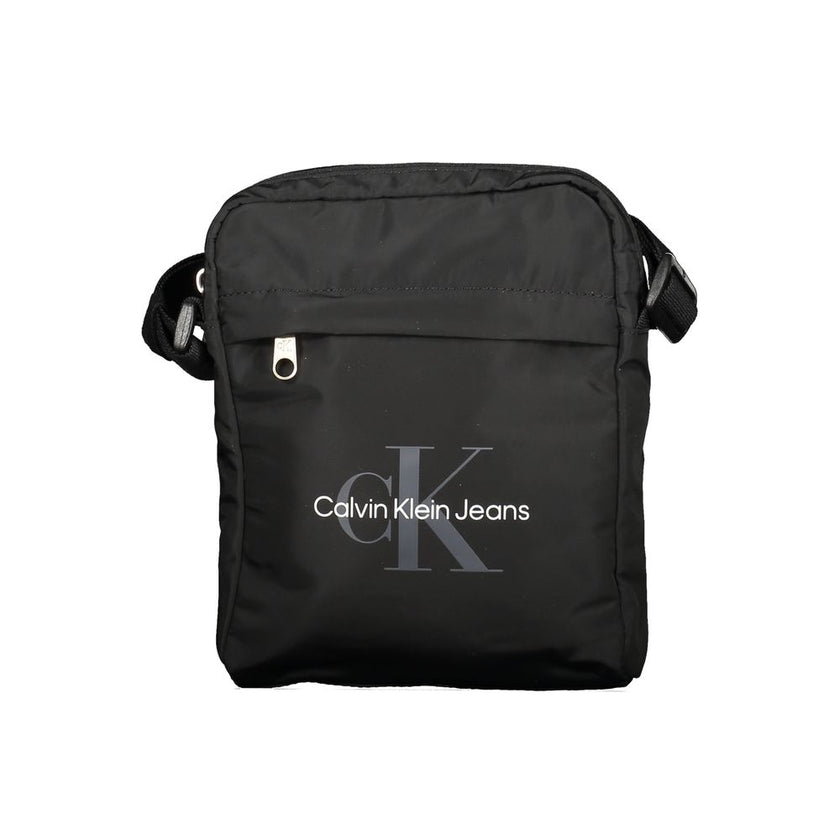 Black Polyester Men Shoulder BagElevate your accessory game with the sleek Calvin Klein Shoulder Bag, perfect for the modern trendsetter. Boasting a bold black hue and crafted with environmental consciousness in mind, this bag features a 95% recycled poly