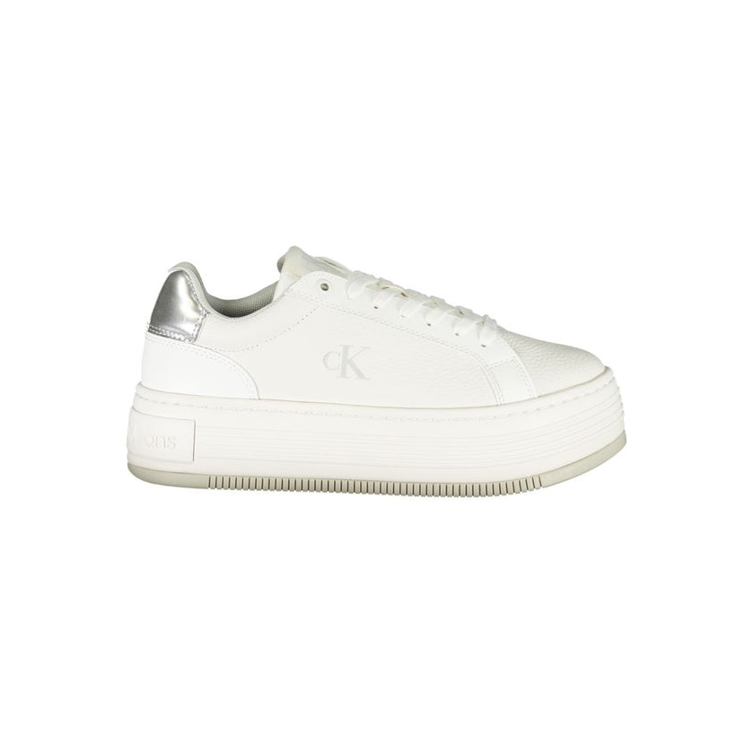 White Leather Women SneakerElevate your sneaker game with Calvin Klein’s eye-catching fusion of style and comfort. Designed for those with a penchant for the bold, these sneakers boast a sleek white profile accented with contrasting silver details that ca