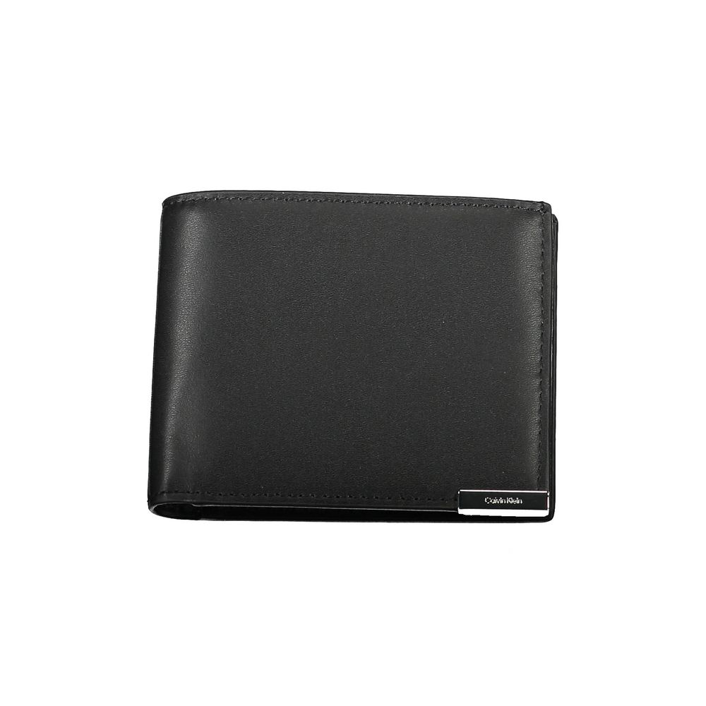 Black Polyethylene Men WalletElevate your essentials with the Calvin Klein dual-compartment wallet. Crafted for the modern man, this sleek piece is more than a mere accessory; it’s a statement. Equipped with RFID blocking technology, it safeguards your ca