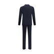 Black Fleece Wool Two-Piece SuitDsquared2 Virgin Wool London Suit, consisting of jacket and pants. Wool blazer jacket, front button closure, three welt pockets on the front with flap, one slit pocket on the front, peaked lapels. Classic wool pants, front