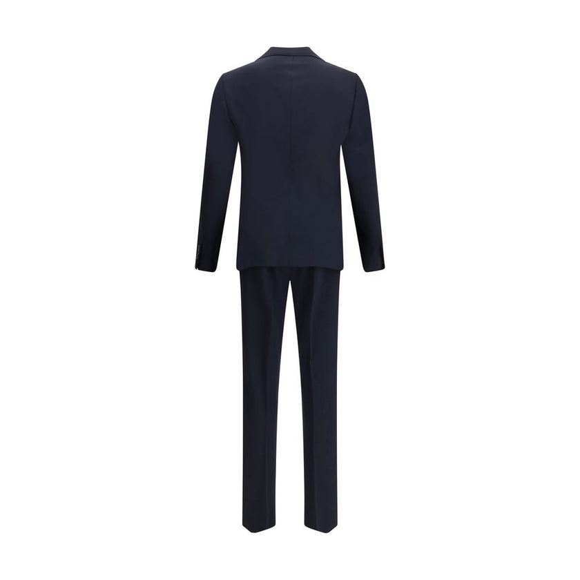 Black Fleece Wool Two-Piece SuitDsquared2 Virgin Wool London Suit, consisting of jacket and pants. Wool blazer jacket, front button closure, three welt pockets on the front with flap, one slit pocket on the front, peaked lapels. Classic wool pants, front