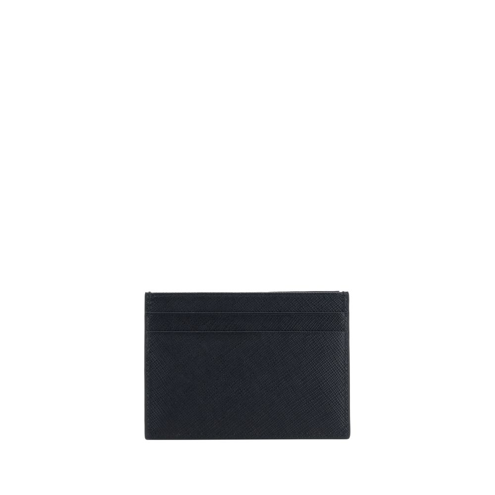Black Calf Leather Bos Taurus WalletPrada’s Leather Card Holder is a compact and stylish accessory perfect for everyday use. Featuring card slots on the front and back, it combines functionality and style in an essential design. The iconic enameled triang