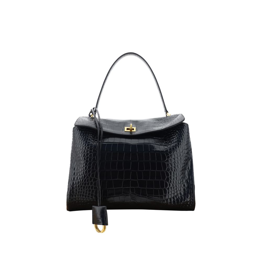 Black Calf Leather Bos Taurus HandbagLeather Medium Rodeo Handbag by Balenciaga, single removable top handle, charm with key ring detail applied at base of handle, dual compartment, flap closure with swivel system at front, crocodile-effect leather design