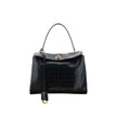 Black Calf Leather Bos Taurus HandbagLeather Medium Rodeo Handbag by Balenciaga, single removable top handle, charm with key ring detail applied at base of handle, dual compartment, flap closure with swivel system at front, crocodile-effect leather design