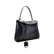Black Calf Leather Bos Taurus HandbagLeather Medium Rodeo Handbag by Balenciaga, single removable top handle, charm with key ring detail applied at base of handle, dual compartment, flap closure with swivel system at front, crocodile-effect leather design