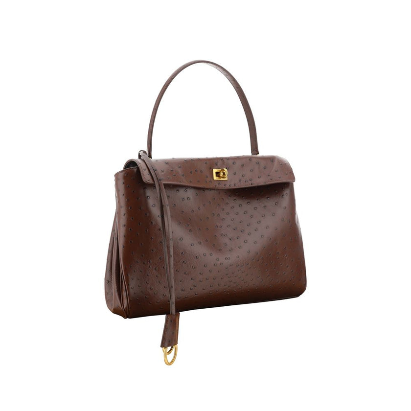 Brown Calf Leather Bos Taurus Shoulder BagRodeo Medium Shoulder Bag by Balenciaga, single top handle, hook-and-eye flap closure at front, adjustable and removable flat shoulder strap, ostrich-effect leather design. Season: AW25 Dimension: 35x35x10 Composi