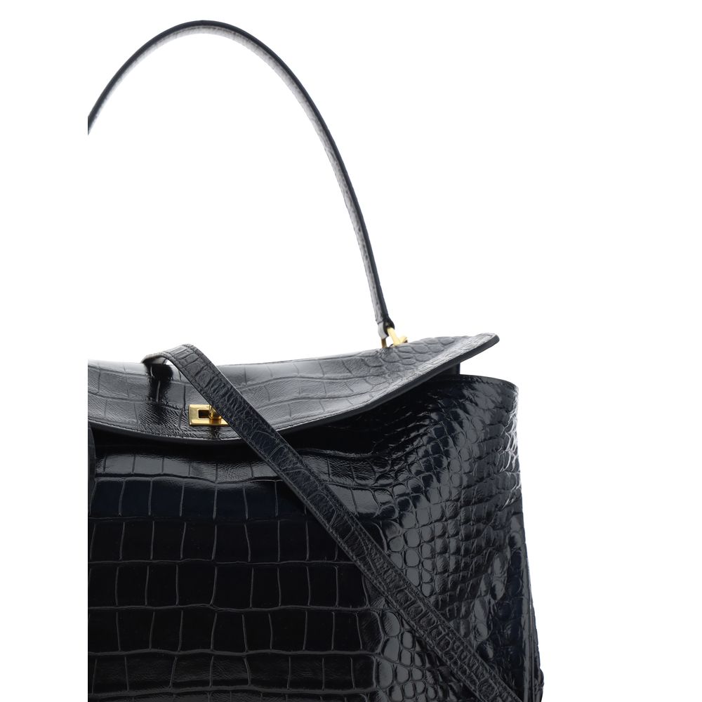 Black Calf Leather Bos Taurus HandbagLeather Medium Rodeo Handbag by Balenciaga, single removable top handle, charm with key ring detail applied at base of handle, dual compartment, flap closure with swivel system at front, crocodile-effect leather design