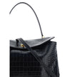 Black Calf Leather Bos Taurus HandbagLeather Medium Rodeo Handbag by Balenciaga, single removable top handle, charm with key ring detail applied at base of handle, dual compartment, flap closure with swivel system at front, crocodile-effect leather design
