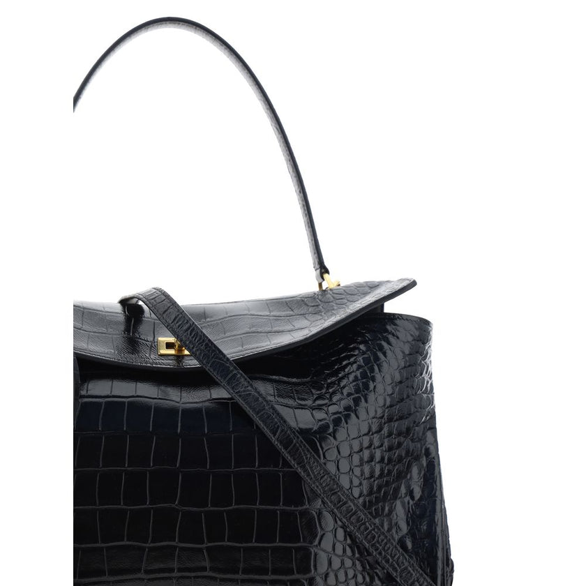 Black Calf Leather Bos Taurus HandbagLeather Medium Rodeo Handbag by Balenciaga, single removable top handle, charm with key ring detail applied at base of handle, dual compartment, flap closure with swivel system at front, crocodile-effect leather design