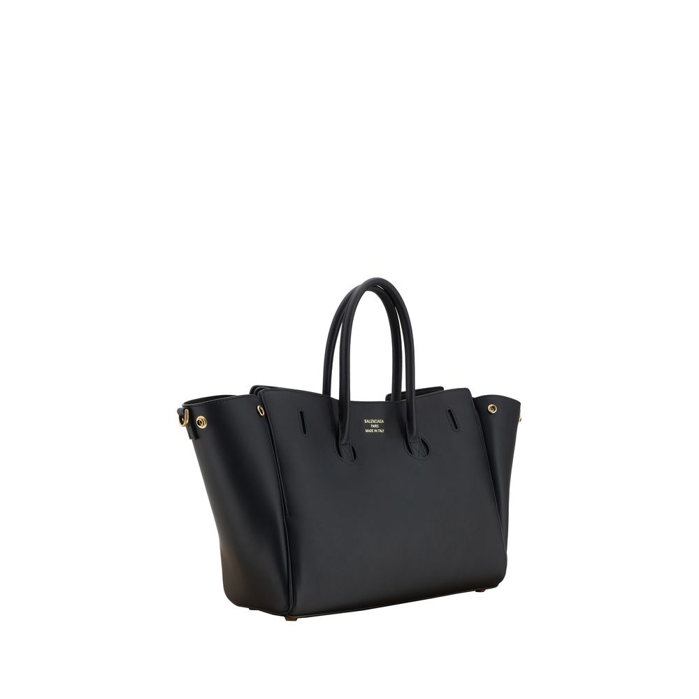 Black Calf Leather Bos Taurus Shoulder BagBalenciaga’s Bel Air small Shoulder Bag is a perfect example of style and functionality. Featuring two tubular leather handles and an adjustable, removable shoulder strap, it offers versatility and comfort. The em