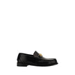 Black Calf Leather Bos Taurus Slip-On LoafersVersace’s leather Loafers combine classic elegance with iconic details. Featuring a slightly elongated round toe and a leather block heel, they feature a front tray embellished with a plaque featuring the iconi