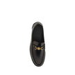 Black Calf Leather Bos Taurus Slip-On LoafersVersace’s leather Loafers combine classic elegance with iconic details. Featuring a slightly elongated round toe and a leather block heel, they feature a front tray embellished with a plaque featuring the iconi