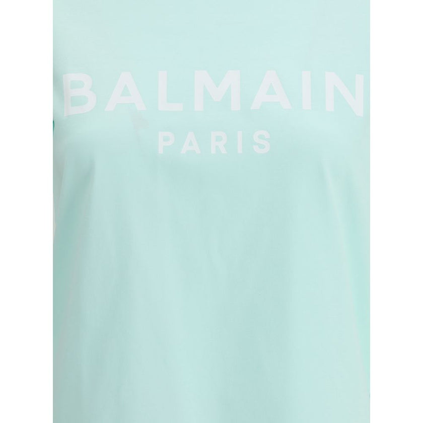 Logoed T-ShirtBalmain’s cotton T-Shirt combines the minimalism of a monochrome pattern with the elegance of the Maison’s iconic details. Made of soft cotton, it features a ribbed crew neck and a regular fit designed for everyday comfort. The design is enr