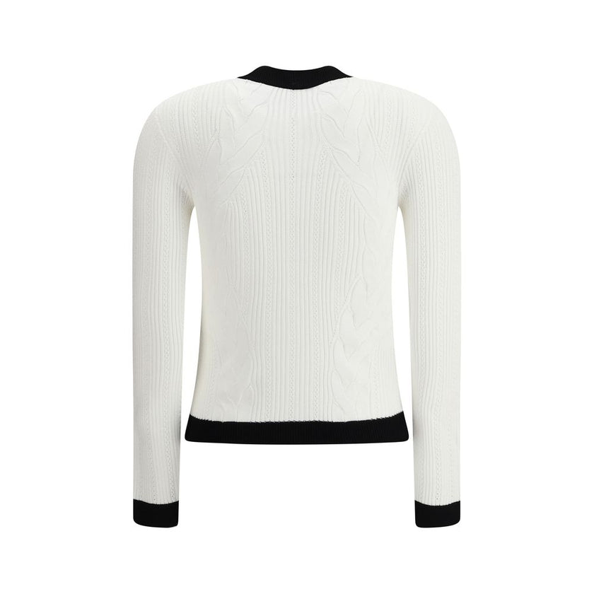 White Viscose CardiganBalmain’s Contrast Trim Cardigan features a ribbed and braided design enhanced by a silhouette-defining ribbed crew neck and hem. The front closure is embellished with embossed gold buttons, an iconic detail that adds a touch of luxu