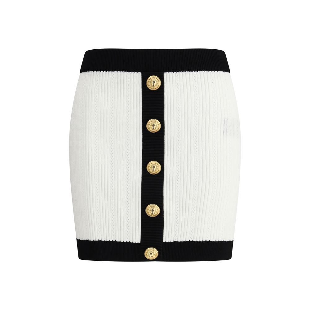 White Viscose Mini SkirtBalmain’s mini Skirt enhances the silhouette with a refined ribbed knit. Decorative gold metal 