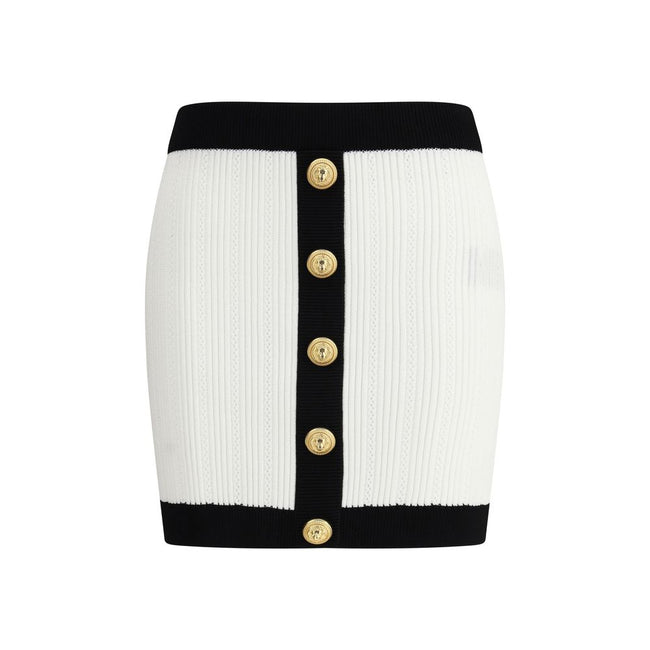 White Viscose Mini SkirtBalmain’s mini Skirt enhances the silhouette with a refined ribbed knit. Decorative gold metal 
