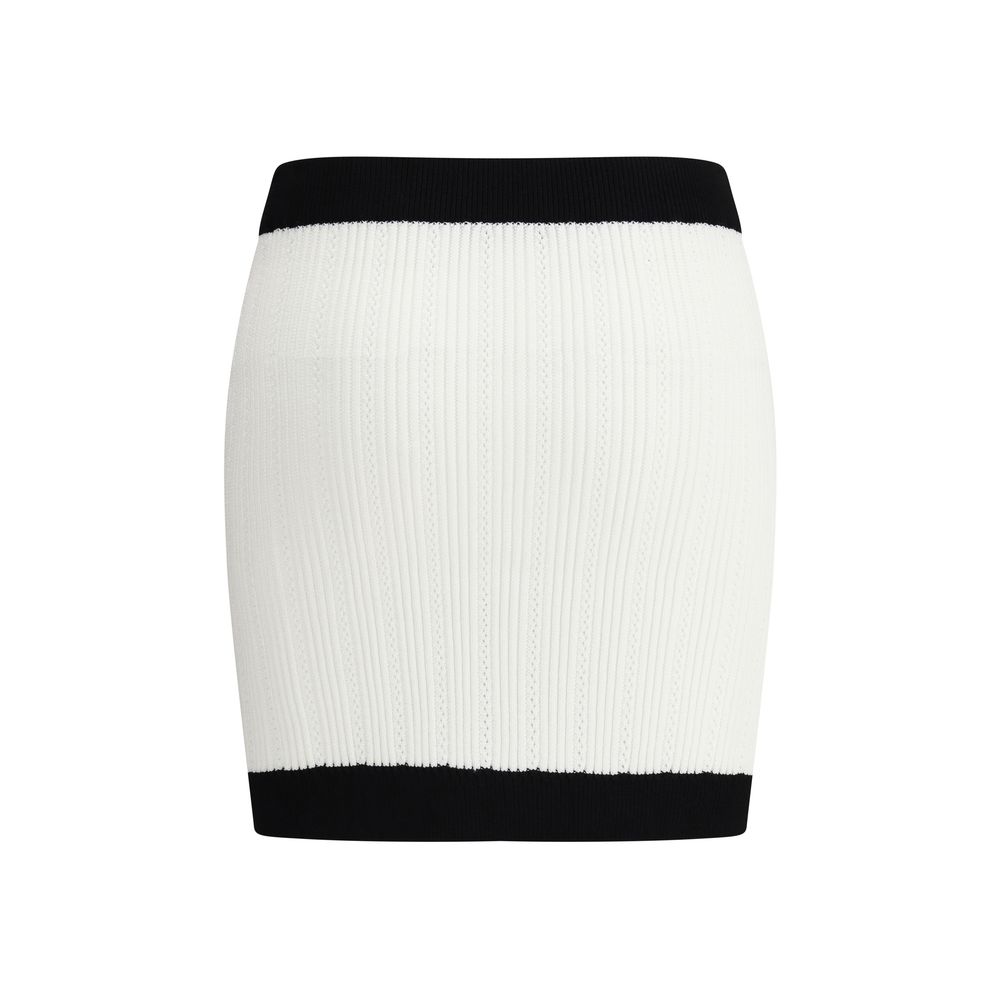 White Viscose Mini SkirtBalmain’s mini Skirt enhances the silhouette with a refined ribbed knit. Decorative gold metal 