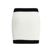 White Viscose Mini SkirtBalmain’s mini Skirt enhances the silhouette with a refined ribbed knit. Decorative gold metal 