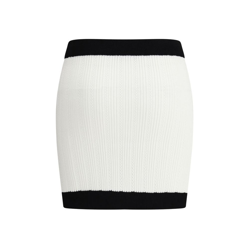 White Viscose Mini SkirtBalmain’s mini Skirt enhances the silhouette with a refined ribbed knit. Decorative gold metal 