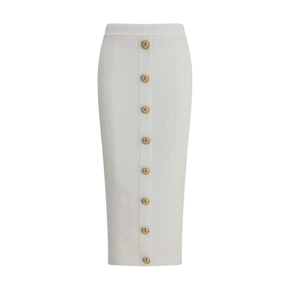 White Viscose Midi SkirtBalmain’s midi Skirt enhances the silhouette with a ribbed and twisted knit, giving structure and movement to the garment. On the front, the characteristic decorative 