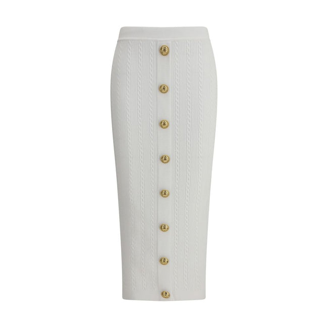 White Viscose Midi SkirtBalmain’s midi Skirt enhances the silhouette with a ribbed and twisted knit, giving structure and movement to the garment. On the front, the characteristic decorative 