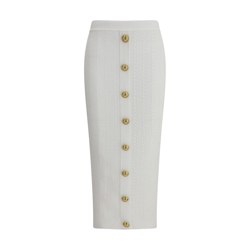 White Viscose Midi SkirtBalmain’s midi Skirt enhances the silhouette with a ribbed and twisted knit, giving structure and movement to the garment. On the front, the characteristic decorative 